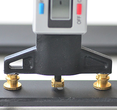 Digital depth gauge for precise film holder adjustments.